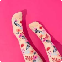 compression socks with colourful floral pattern against white